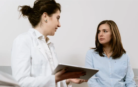 doctor consulting with woman